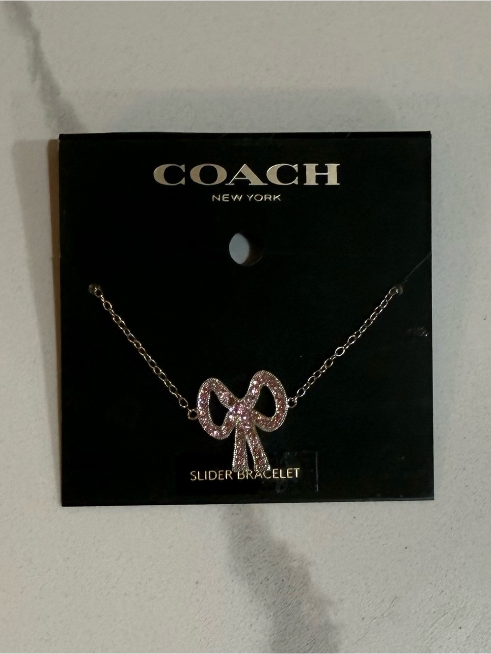 Coach Pink Crystal Bow Slider Bracelet